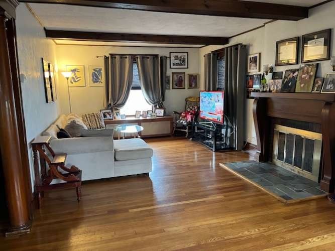 43 Loring Road Winthrop, MA 02152 - Photo 7 of 21 a living room with furniture and a flat screen tv