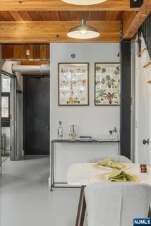 a view of a kitchen with a sink and cabinets