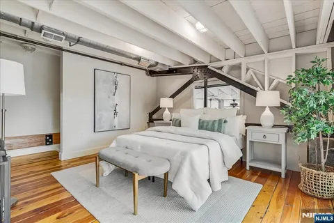 a bed room with a bed and a table