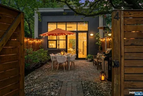a view of a porch with chairs and backyard