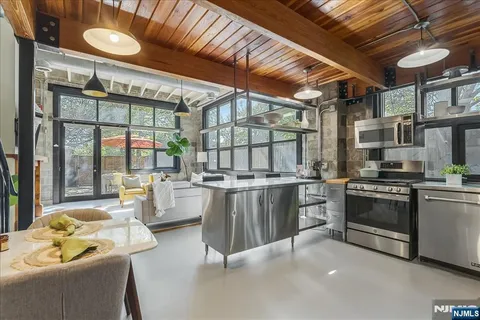 a kitchen with stove and cabinets