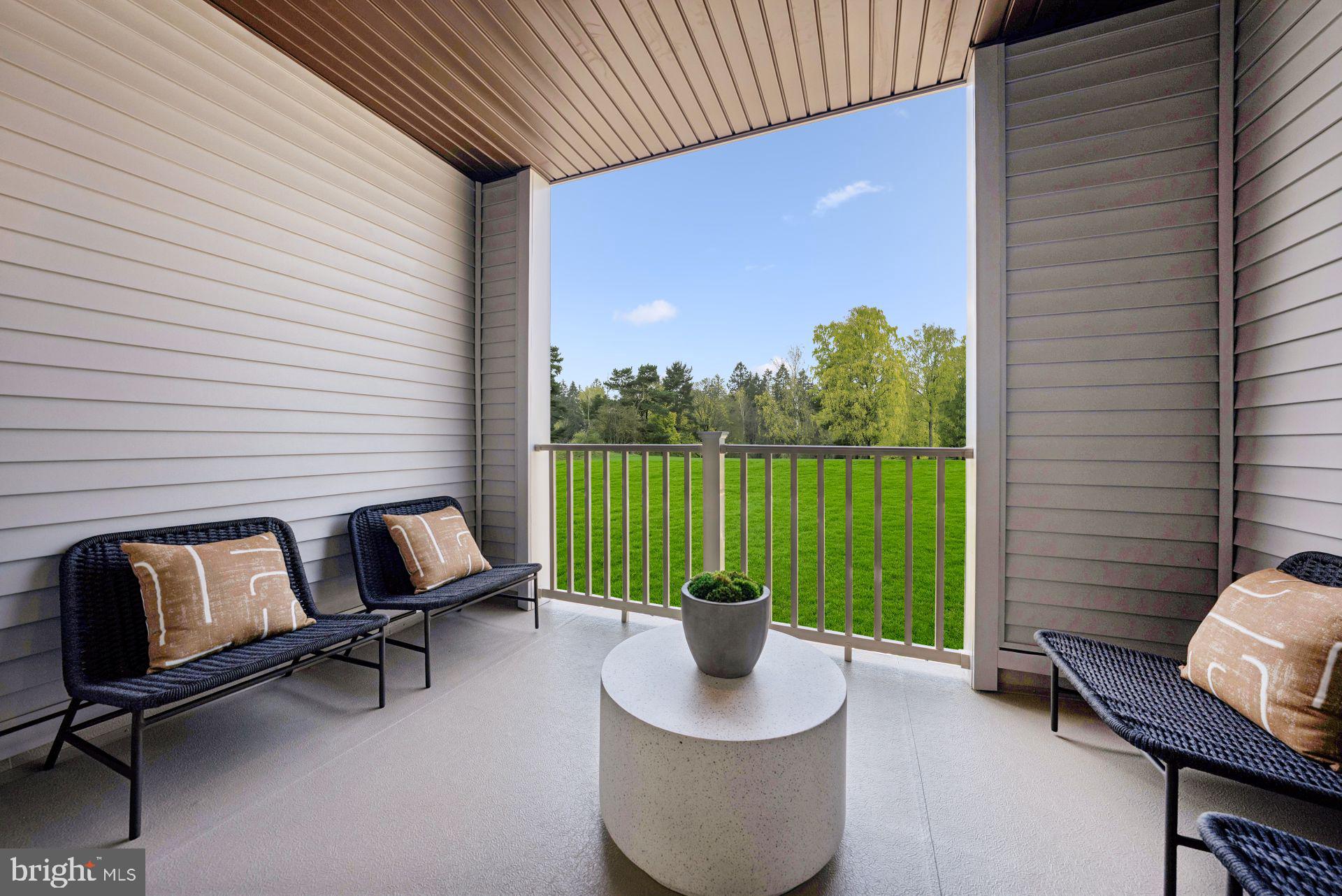 13717 Cobble Loop Woodbridge, VA 22193 - Photo 11 of 34 a view of a balcony with chair and table