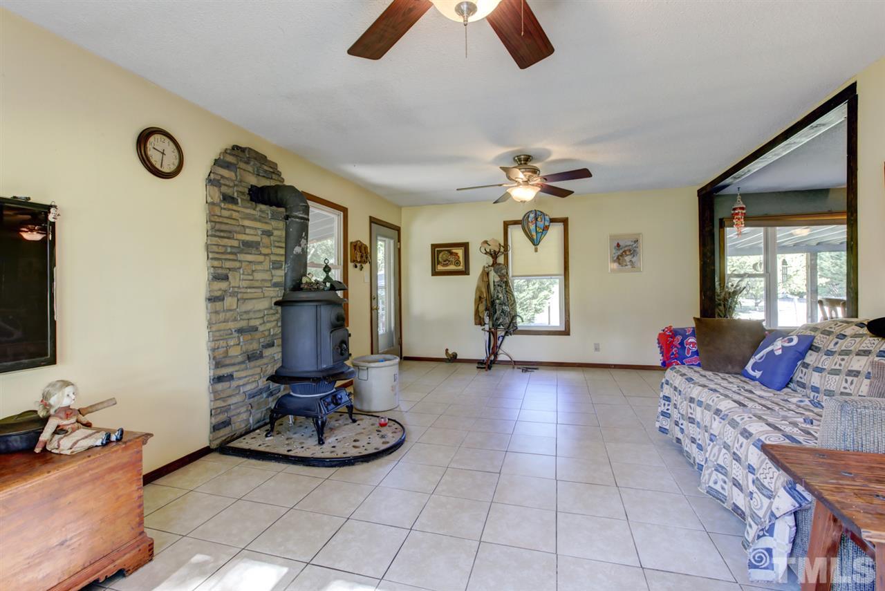 1481 Phillips Road Dunn, NC 28334 - Photo 12 of 30 a living room with furniture and a flat screen tv