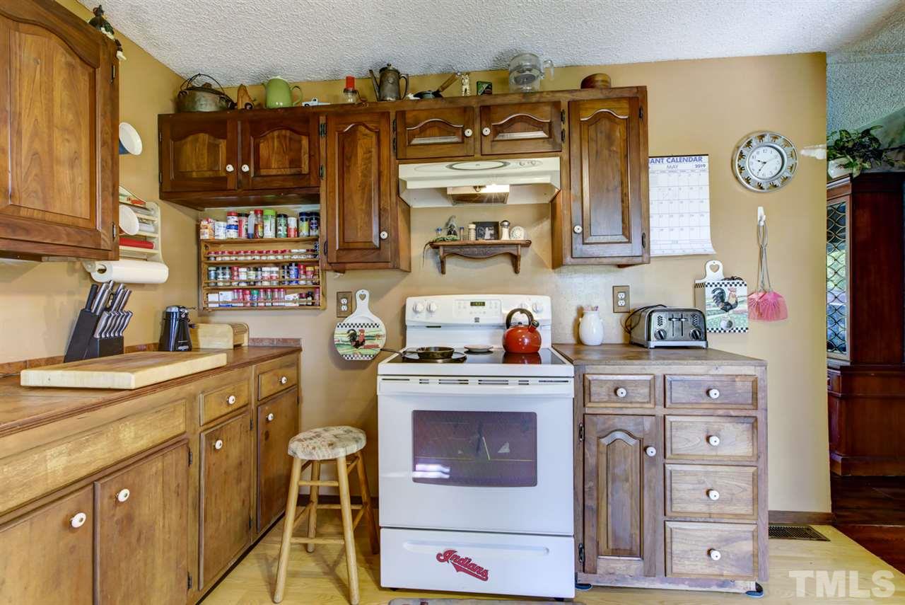 1481 Phillips Road Dunn, NC 28334 - Photo 15 of 30 a kitchen with stainless steel appliances granite countertop a sink and cabinets