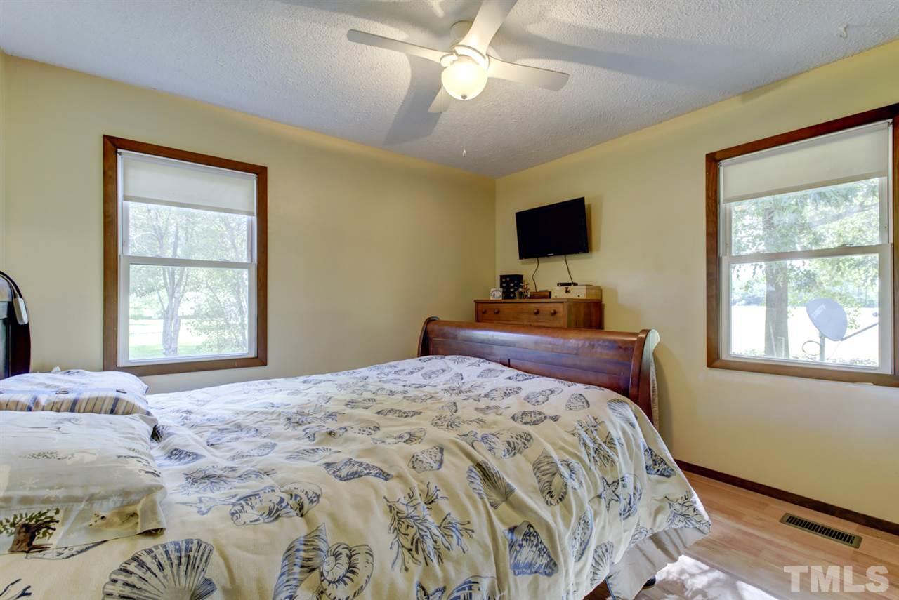 1481 Phillips Road Dunn, NC 28334 - Photo 17 of 30 a bedroom with a bed and a window