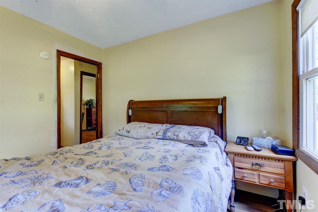 1481 Phillips Road Dunn, NC 28334 - Photo 19 of 30 a bedroom with a bed and a window