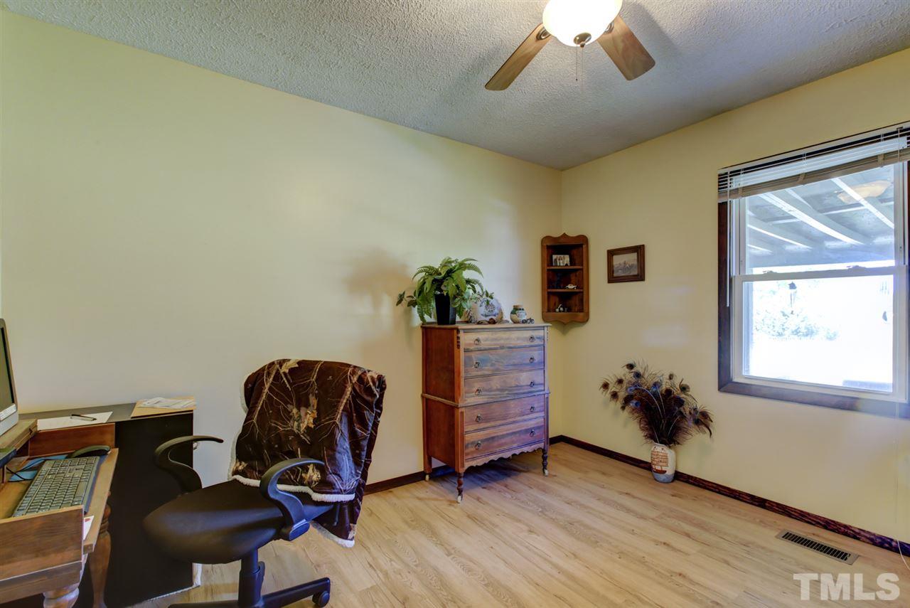 1481 Phillips Road Dunn, NC 28334 - Photo 20 of 30 a workspace with furniture and wooden floor