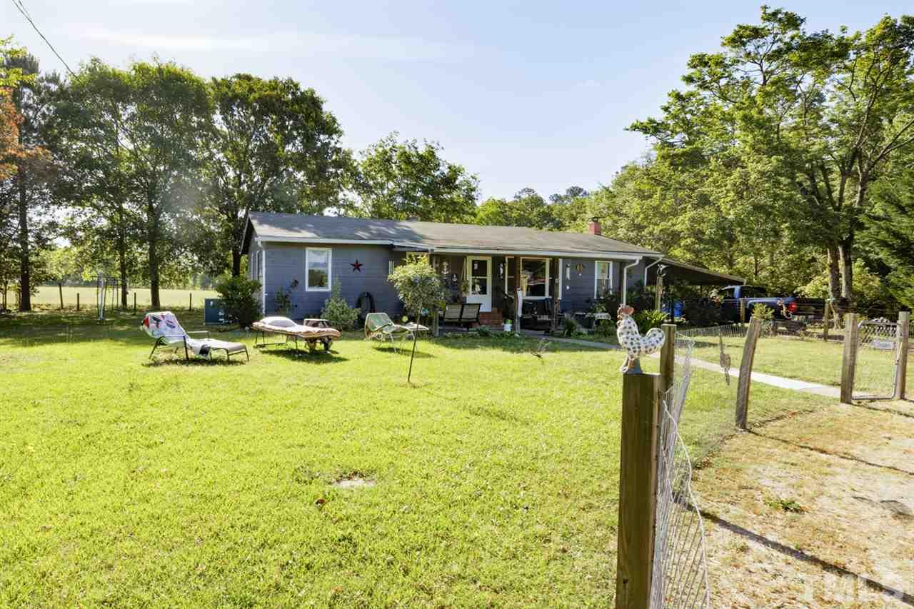 1481 Phillips Road Dunn, NC 28334 - Photo 3 of 30 a swimming pool with outdoor seating and yard