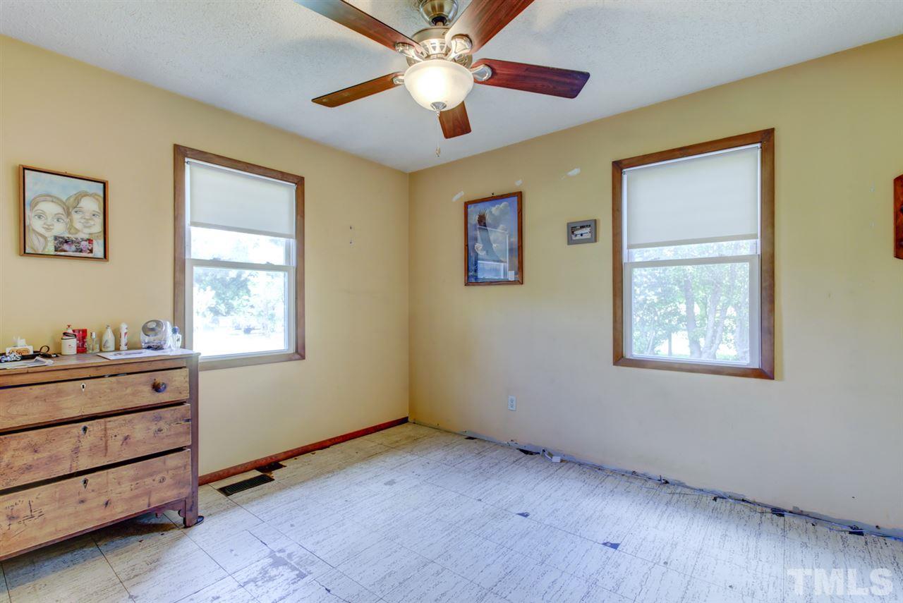 1481 Phillips Road Dunn, NC 28334 - Photo 22 of 30 a view of workspace with window and a ceiling fan