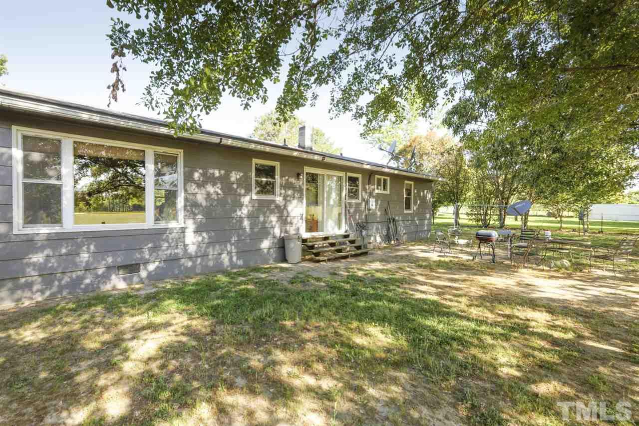 1481 Phillips Road Dunn, NC 28334 - Photo 25 of 30 a view of a house with backyard and sitting area