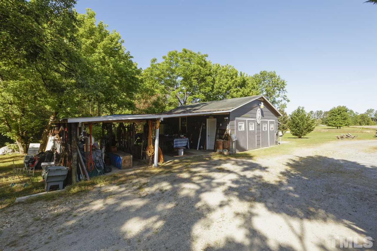 1481 Phillips Road Dunn, NC 28334 - Photo 29 of 30 a view of a barn in the middle of a yard