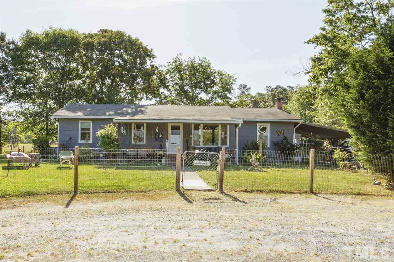 1481 Phillips Road Dunn, NC 28334 - Photo 4 of 30 a view of a house with backyard porch and sitting area