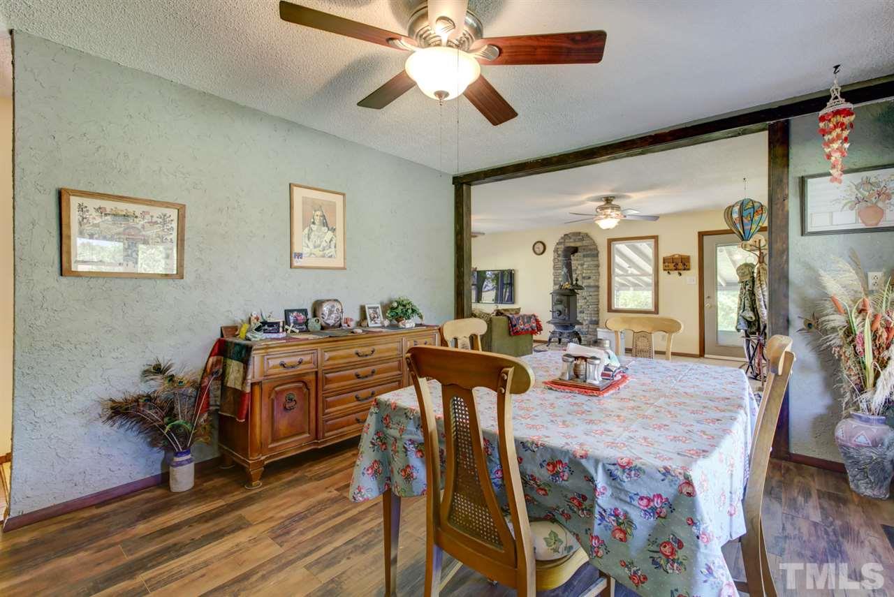 1481 Phillips Road Dunn, NC 28334 - Photo 7 of 30 a view of a dining room with furniture and chandelier