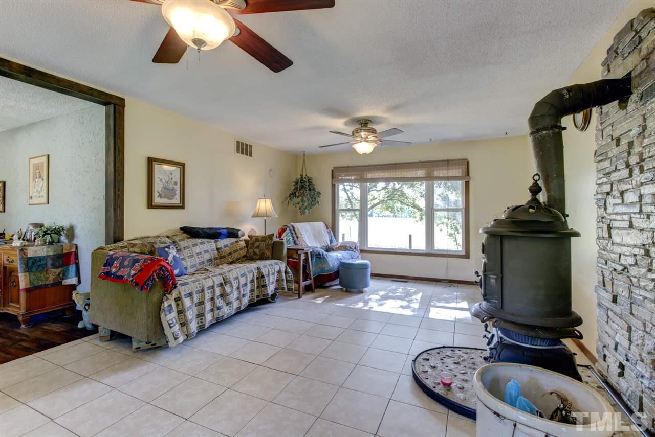 1481 Phillips Road Dunn, NC 28334 - Photo 10 of 30 a living room with furniture and a flat screen tv