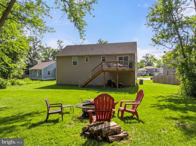 a front view of a house with yard and seating area