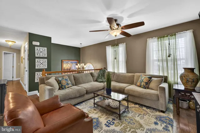 a kitchen with stainless steel appliances granite countertop a refrigerator stove microwave sink and cabinets