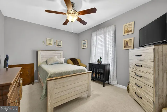a view of a kitchen with workspace and windows