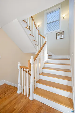 a living room with furniture a rug and a chandelier
