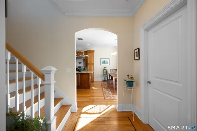 a bathroom with a granite countertop toilet sink and mirror
