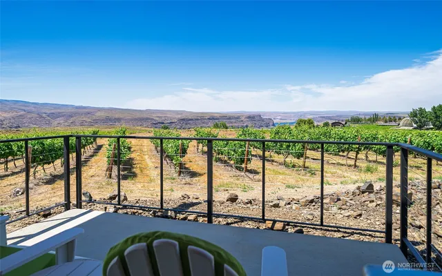 a view of a balcony dining area with furniture