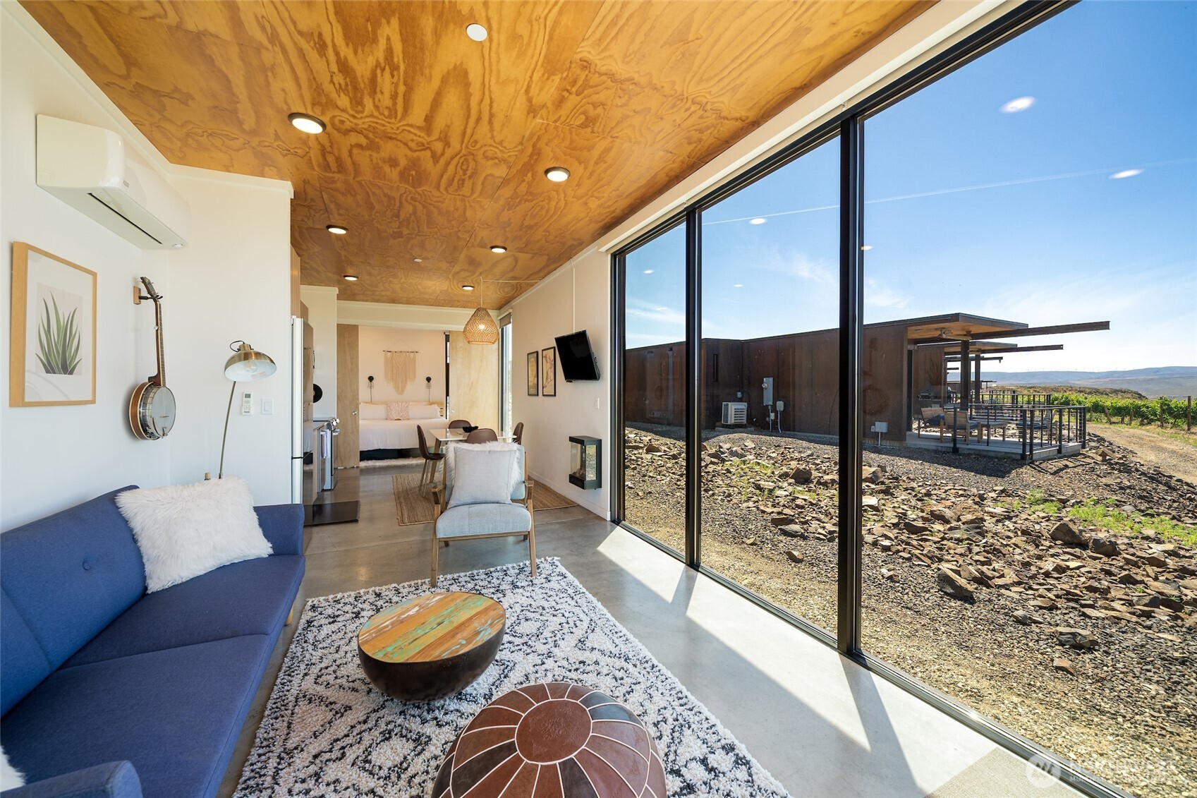 23648 Northwest Cliffe Pointe Road, Unit 10C Quincy, WA 98848 - Photo 3 of 26 a living room with furniture and a table