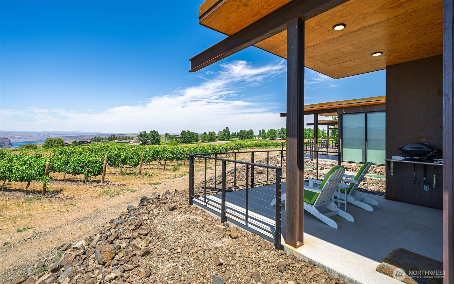 23648 Northwest Cliffe Pointe Road, Unit 10C Quincy, WA 98848 - Photo 5 of 26 a view of a terrace with chairs