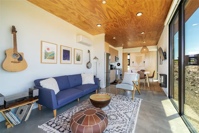 a living room with furniture and a rug