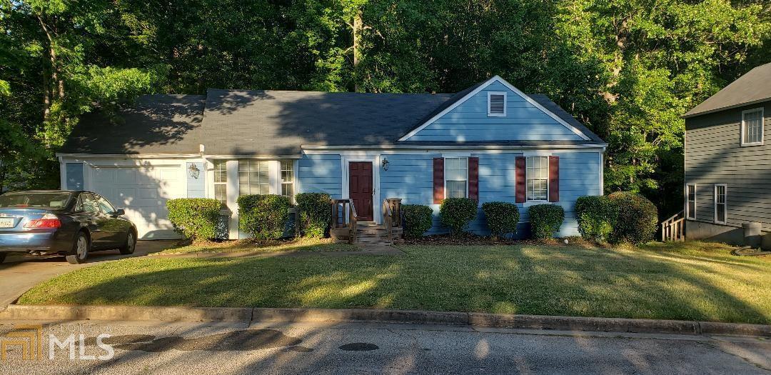 3024 Rapids Drive Decatur, GA 30034 - Photo 1 of 1 a front view of a house with a yard table and chairs