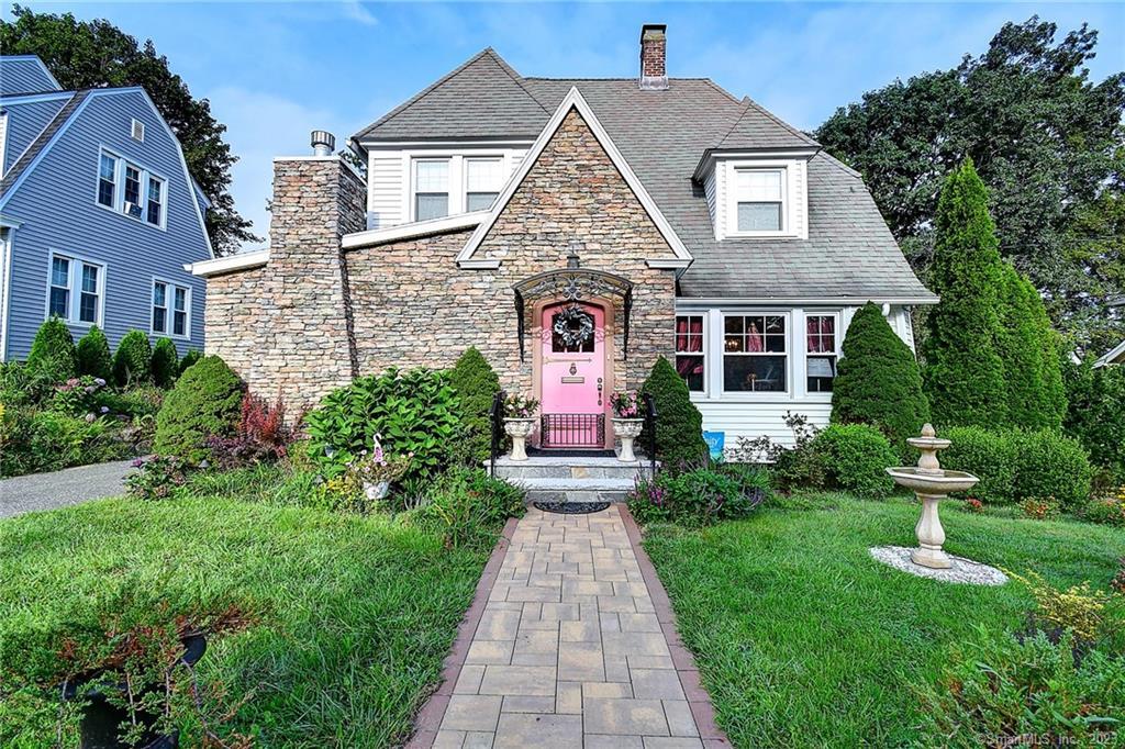 a front view of a house with yard