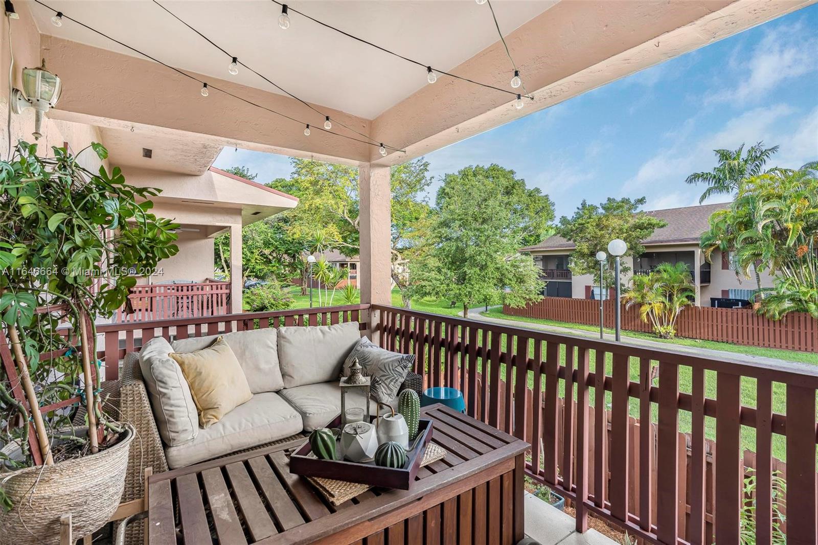 11249 Southwest 88th Street, Unit 203G Miami, FL 33173 - Photo 1 of 37 a view of a chairs and table in the balcony