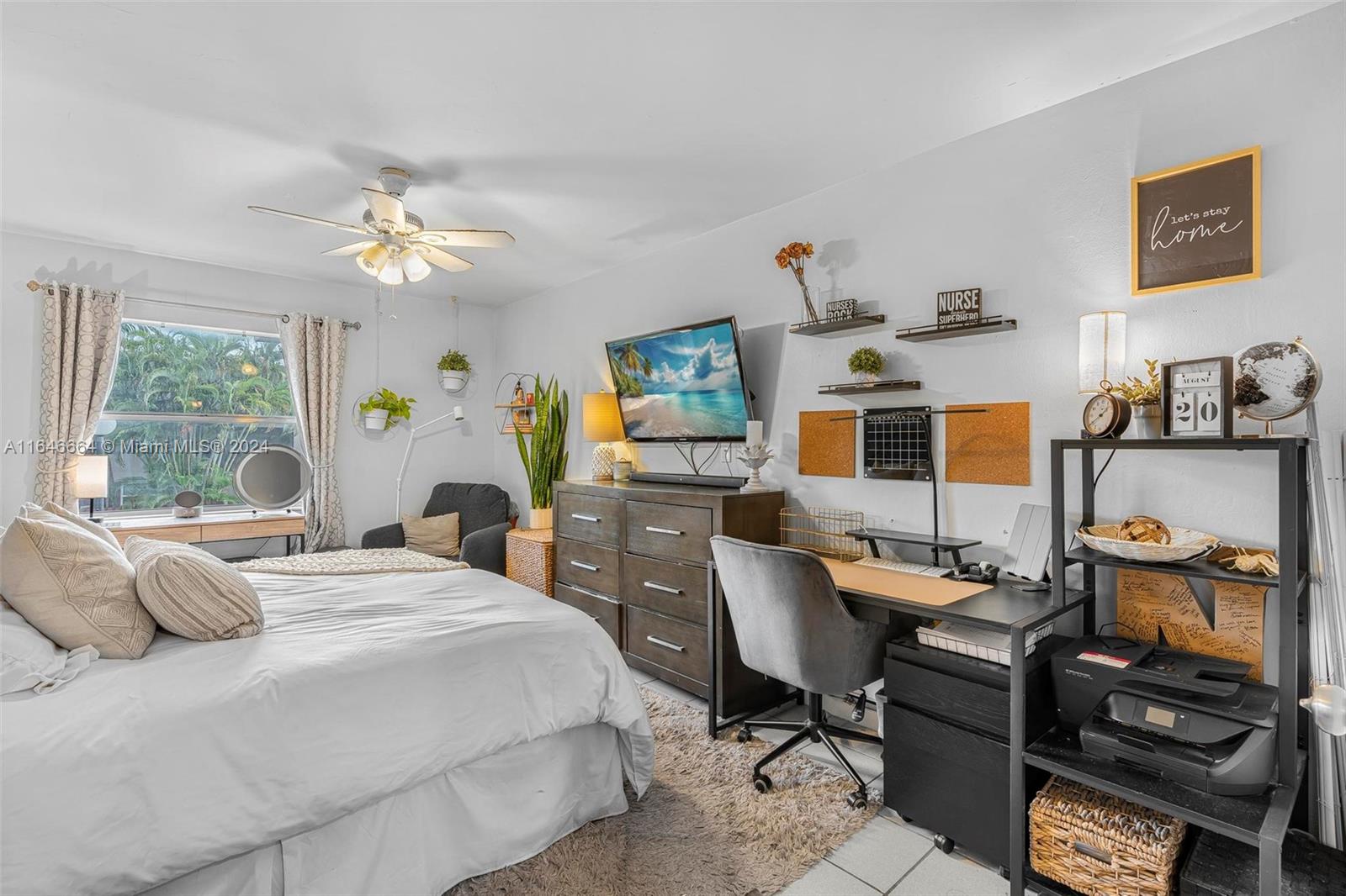 11249 Southwest 88th Street, Unit 203G Miami, FL 33173 - Photo 16 of 37 a bedroom with a bed work place and windows