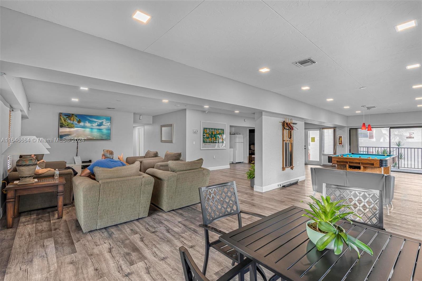 11249 Southwest 88th Street, Unit 203G Miami, FL 33173 - Photo 23 of 37 a living room with furniture and wooden floor