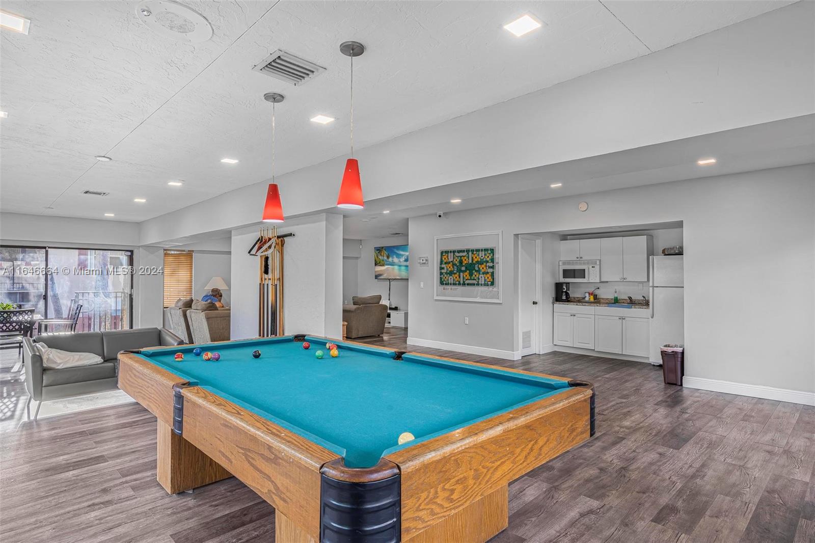 11249 Southwest 88th Street, Unit 203G Miami, FL 33173 - Photo 24 of 37 a room with pool table and windows