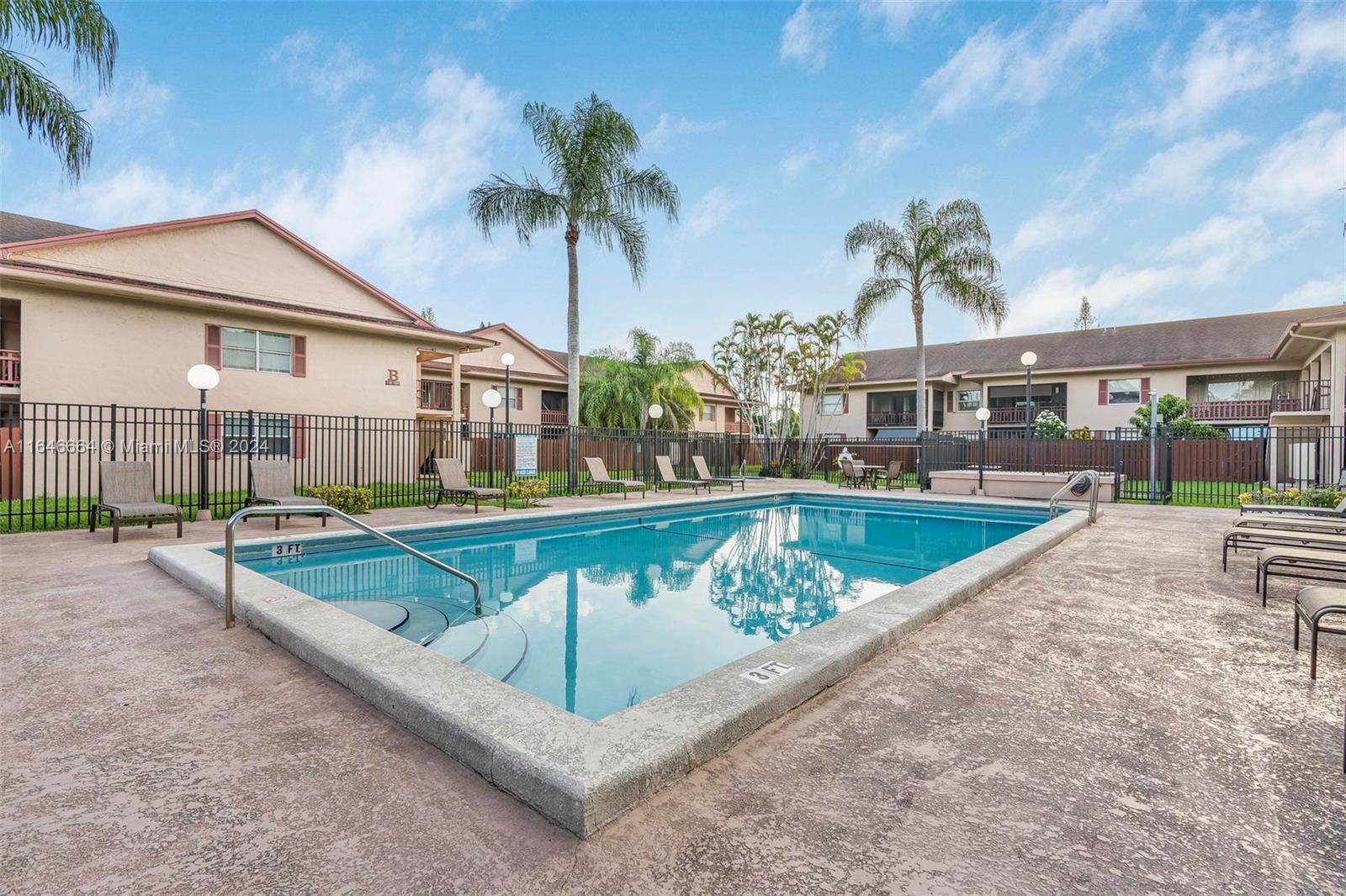 11249 Southwest 88th Street, Unit 203G Miami, FL 33173 - Photo 28 of 37 a view of a swimming pool with a patio