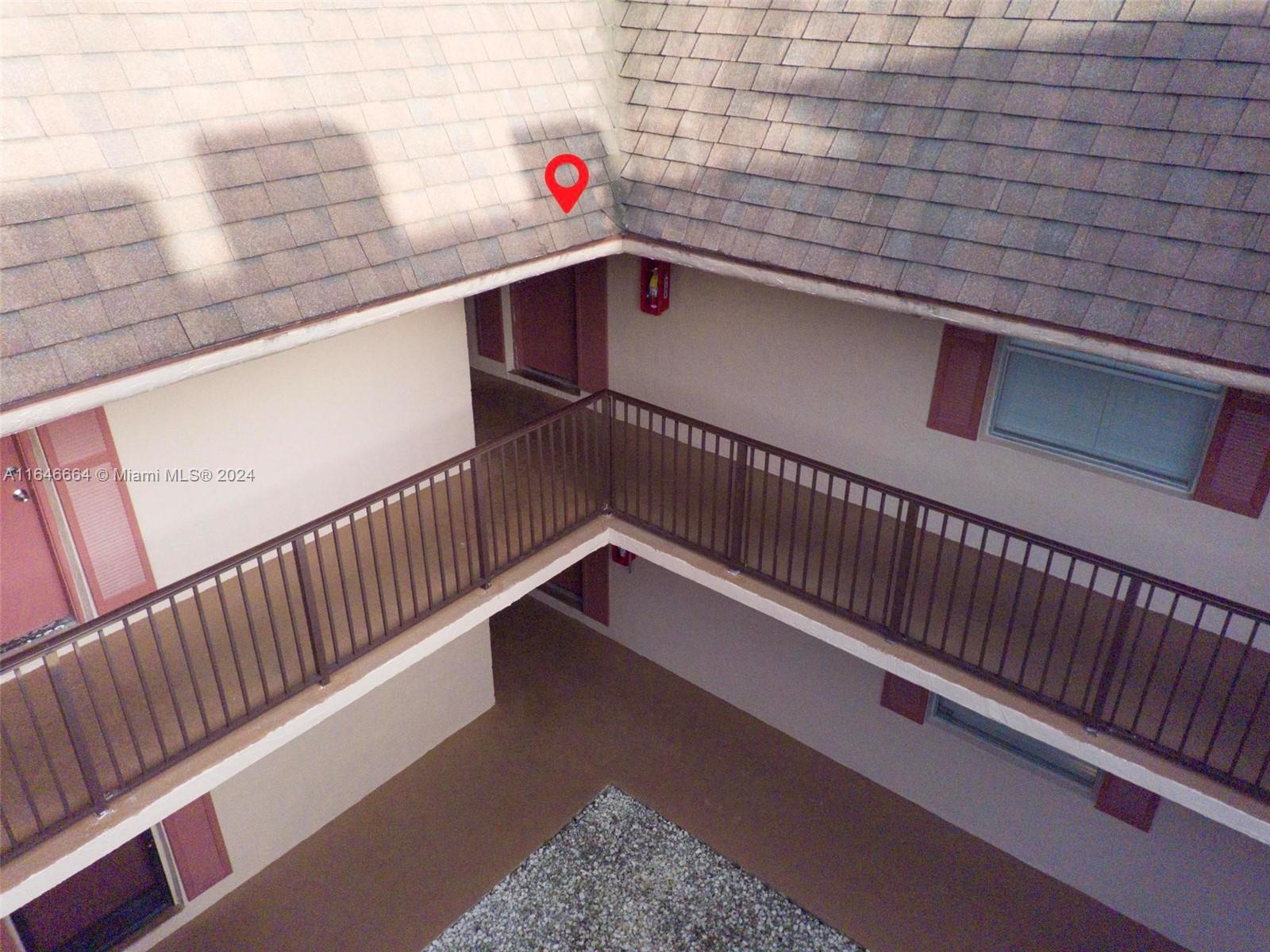 11249 Southwest 88th Street, Unit 203G Miami, FL 33173 - Photo 34 of 37 a view of balcony with wooden floor and fence