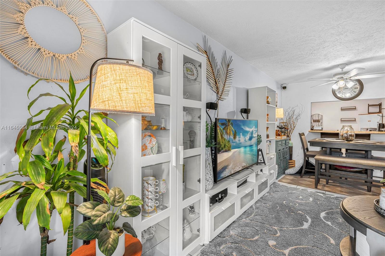 11249 Southwest 88th Street, Unit 203G Miami, FL 33173 - Photo 10 of 37 a living room with furniture and a potted plant