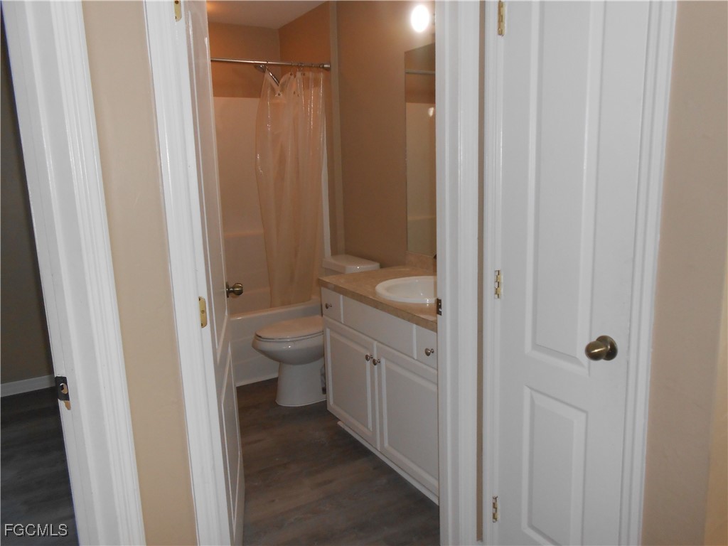 3208 71st Street West Lehigh Acres, FL 33971 - Photo 17 of 24 a bathroom with a granite countertop sink a toilet and shower