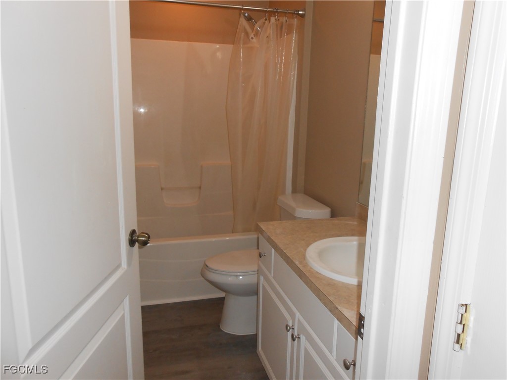 3208 71st Street West Lehigh Acres, FL 33971 - Photo 18 of 24 a bathroom with a sink toilet and shower