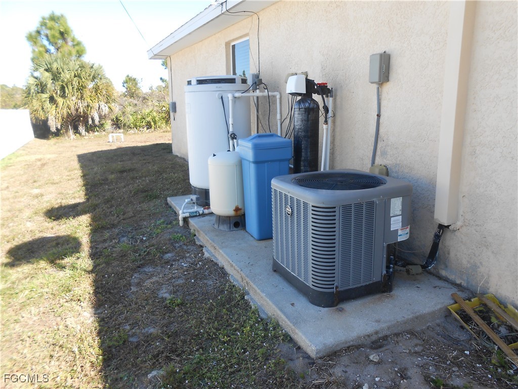 3208 71st Street West Lehigh Acres, FL 33971 - Photo 19 of 24 a view of a porch with chairs