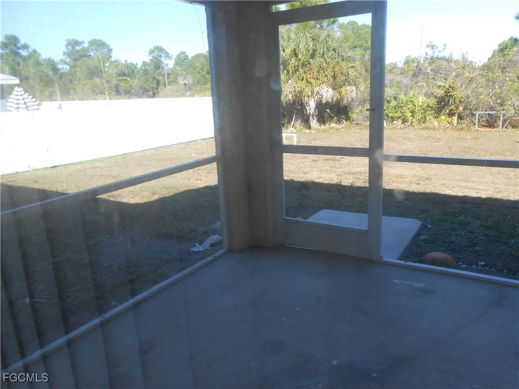 3208 71st Street West Lehigh Acres, FL 33971 - Photo 20 of 24 a view of lot of window and an outdoor space