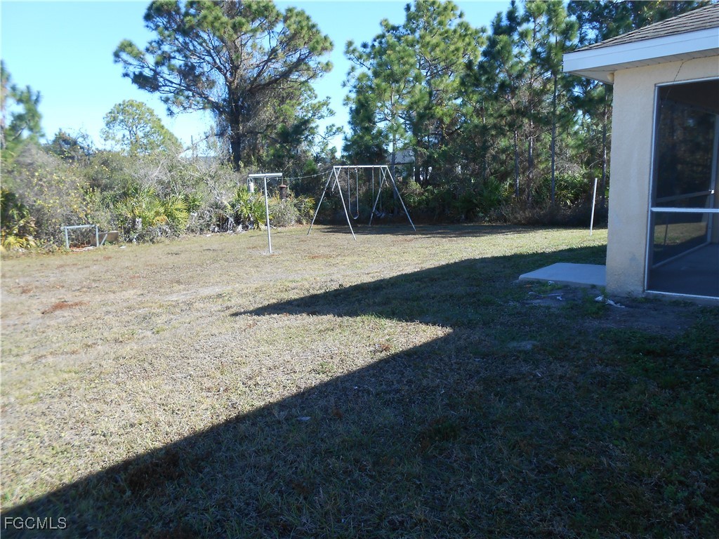 3208 71st Street West Lehigh Acres, FL 33971 - Photo 22 of 24 a view of a backyard
