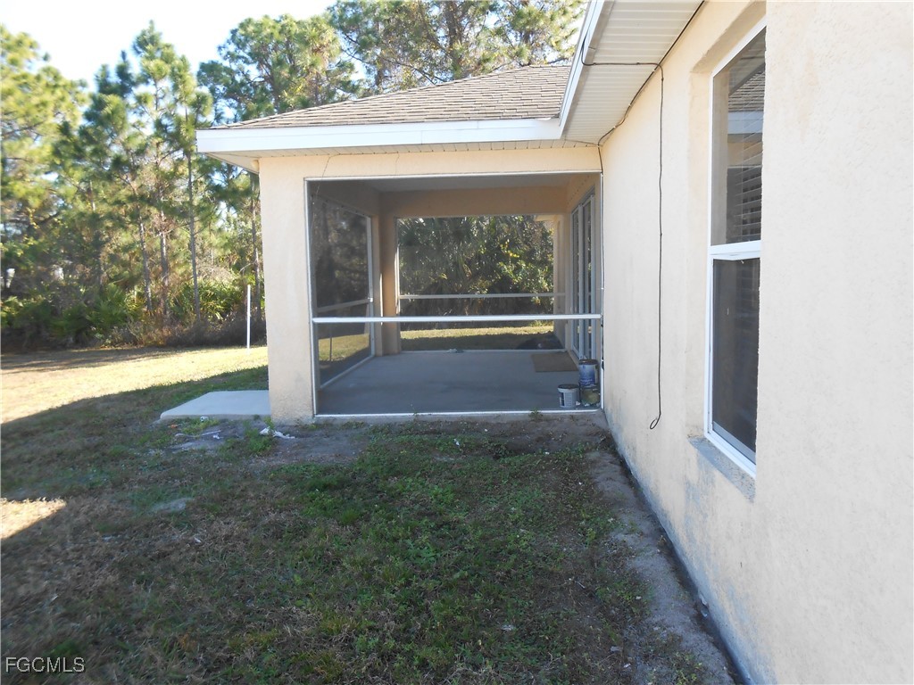 3208 71st Street West Lehigh Acres, FL 33971 - Photo 24 of 24 a view of porch with a yard
