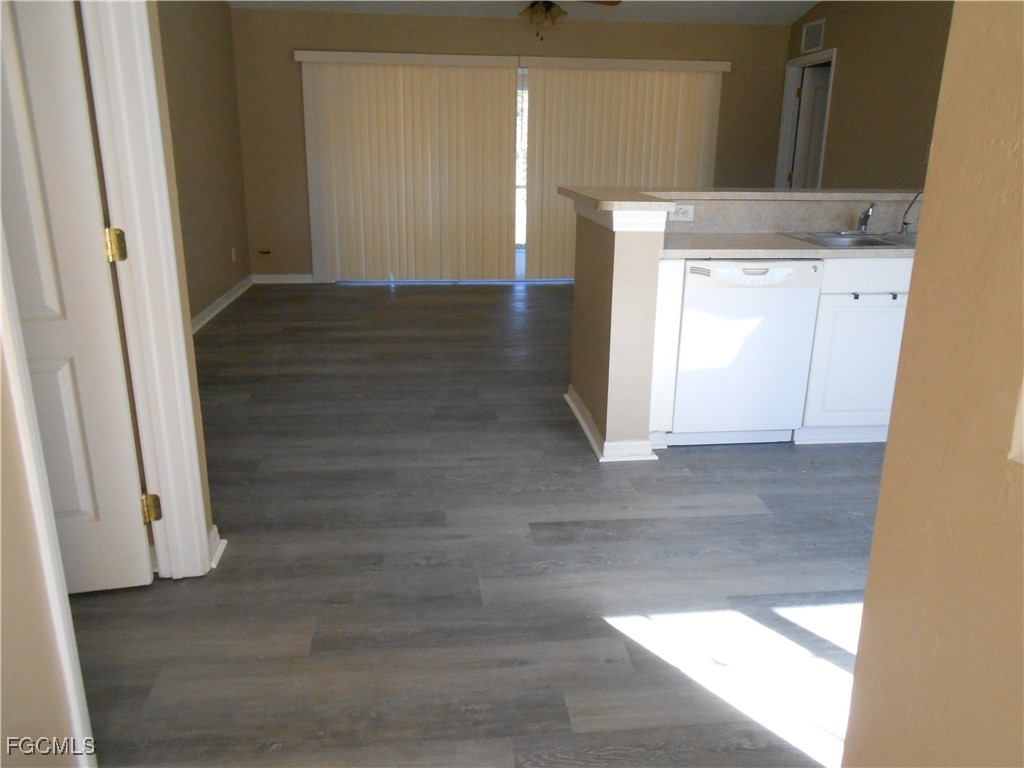 3208 71st Street West Lehigh Acres, FL 33971 - Photo 4 of 24 a view of hallway with wooden floor