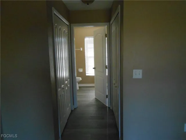 a view of a bathroom from a hallway