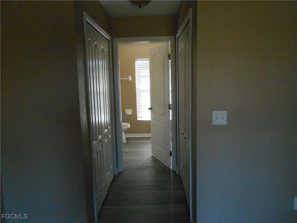 3208 71st Street West Lehigh Acres, FL 33971 - Photo 10 of 24 a view of a bathroom from a hallway