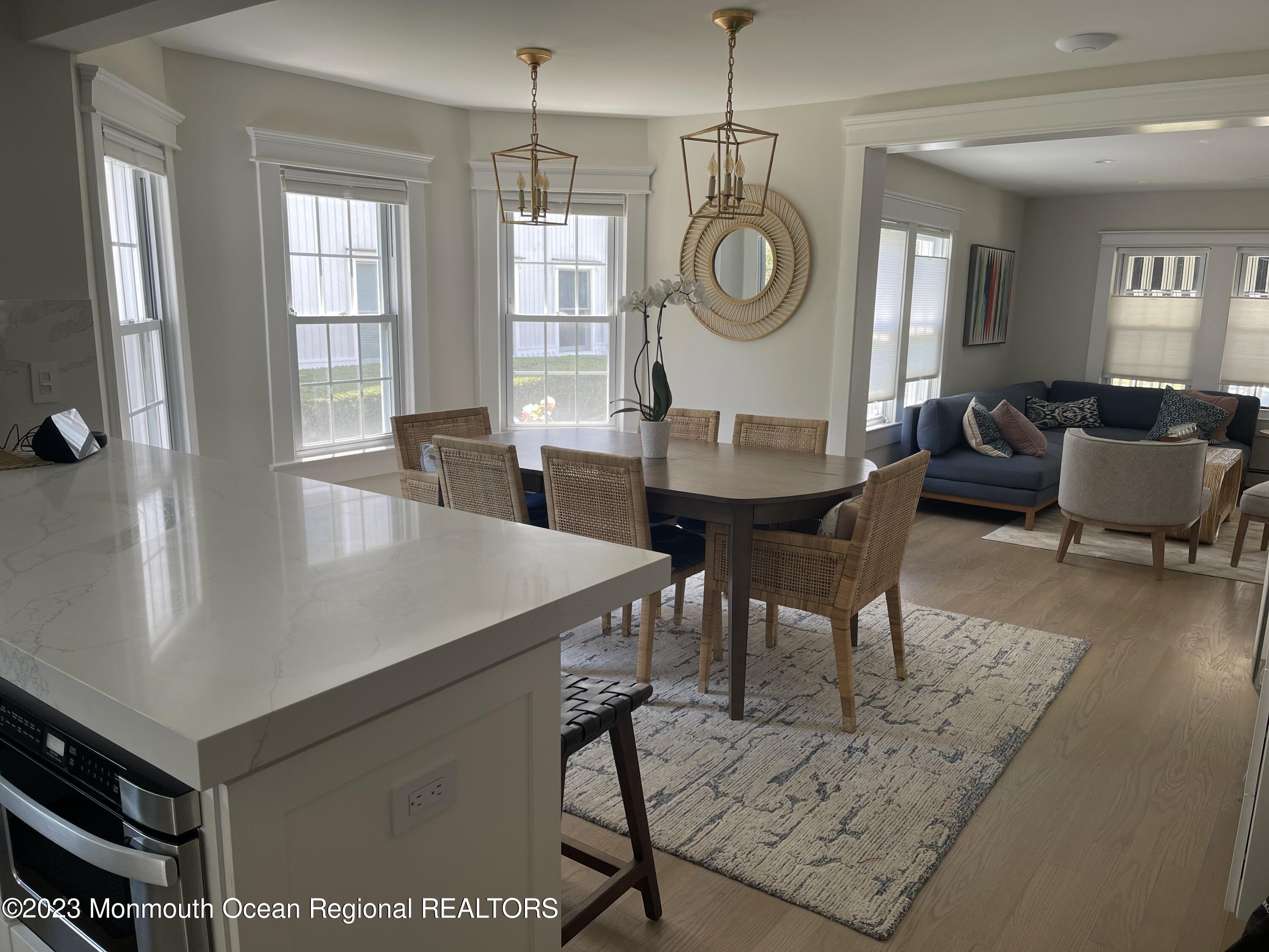 a large kitchen with a table and chairs