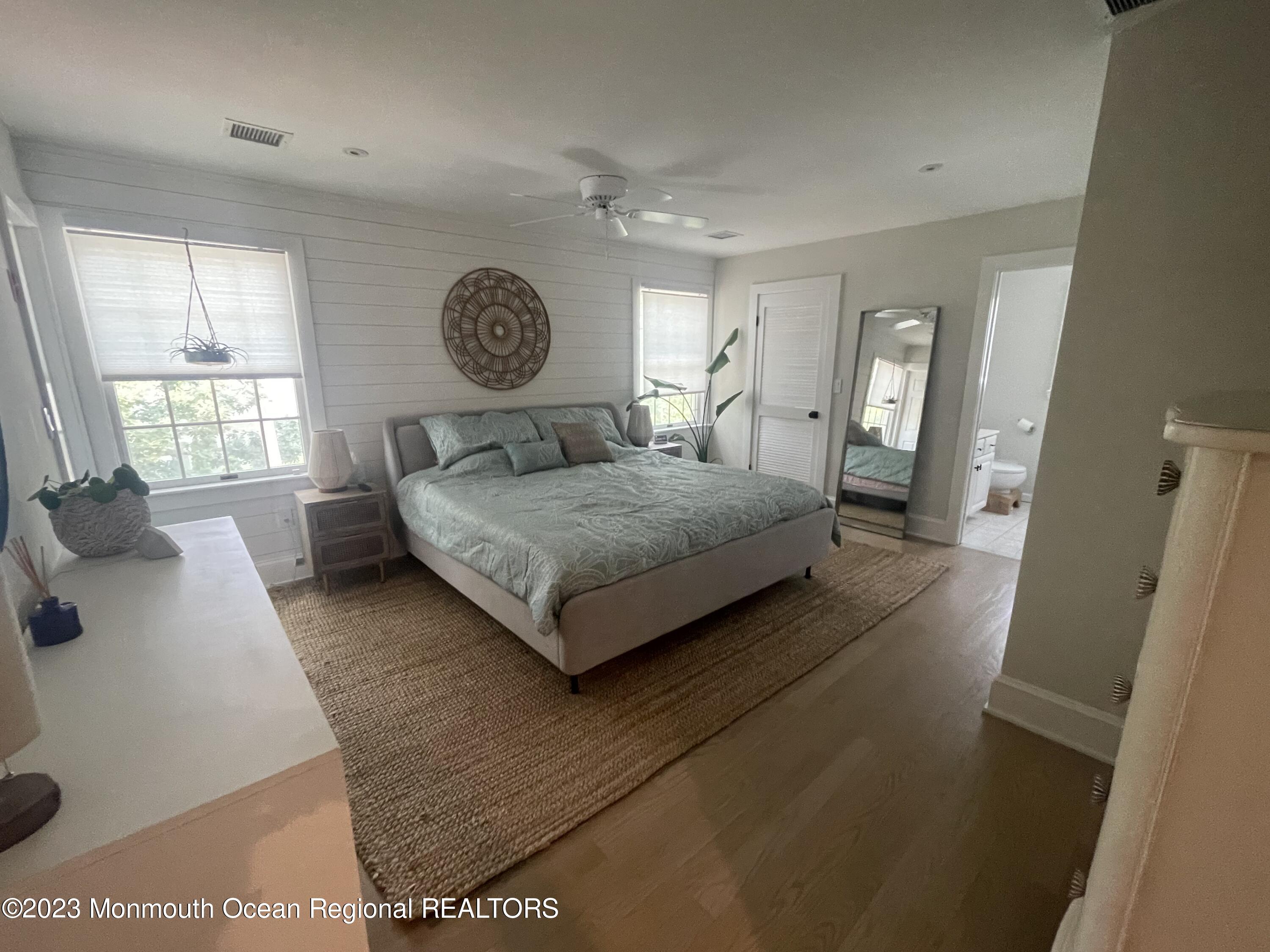 2112 Edgewood Place Spring Lake, NJ 07762 - Photo 11 of 24 a living room with a bed furniture and a large window