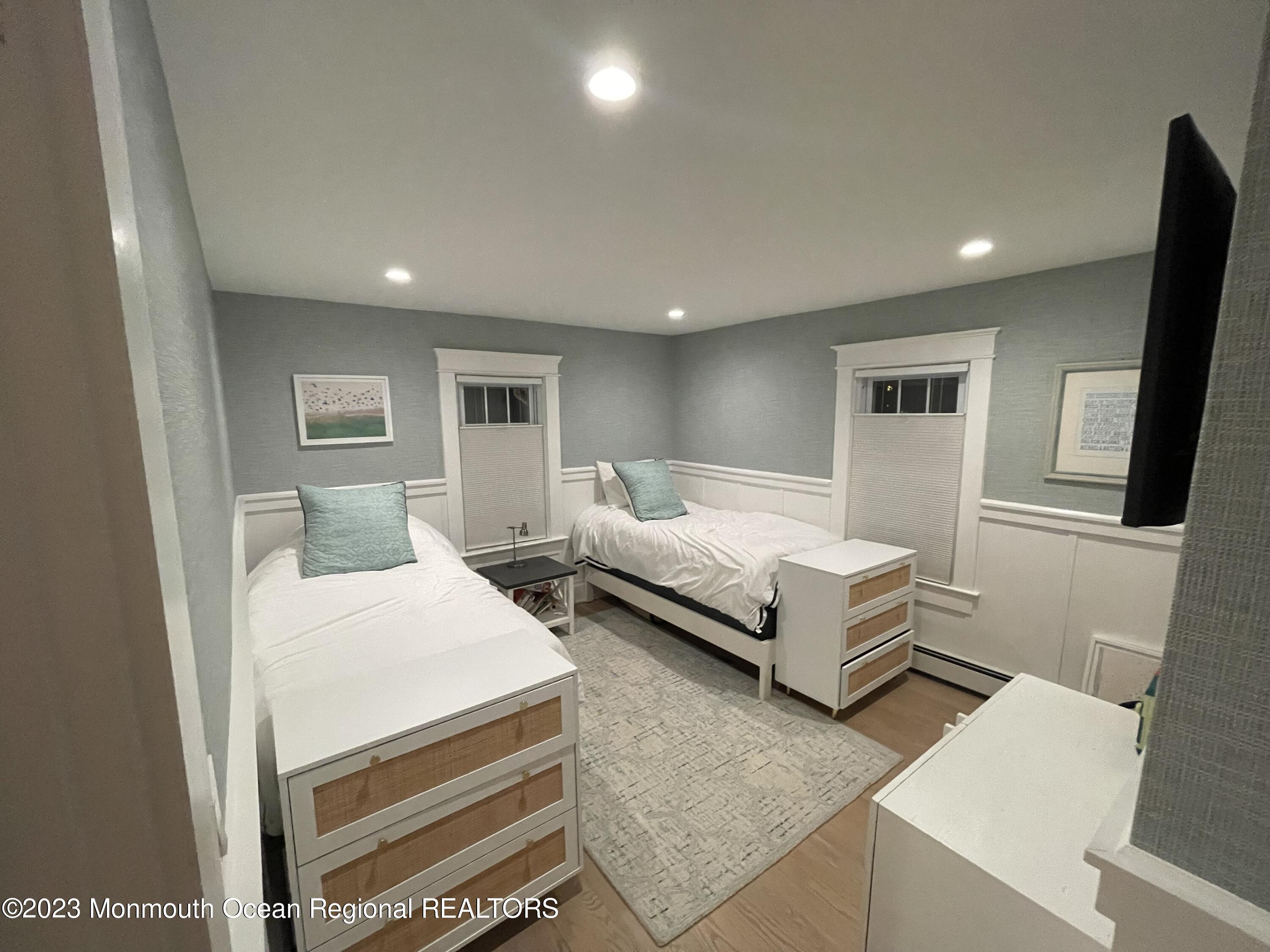 2112 Edgewood Place Spring Lake, NJ 07762 - Photo 12 of 24 a bedroom with a bed and a night stand