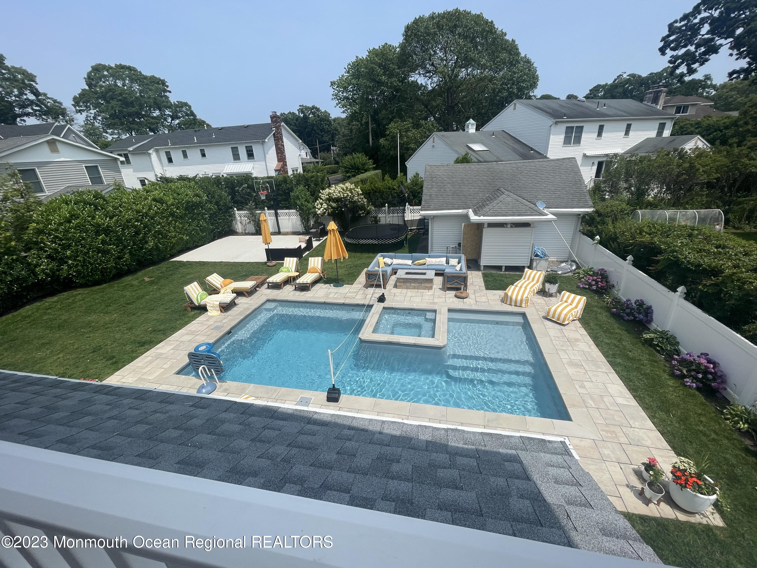 2112 Edgewood Place Spring Lake, NJ 07762 - Photo 17 of 24 a view of a house with pool porch and chairs