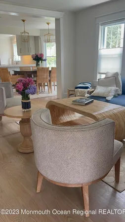 a view of living room with furniture and a potted plant